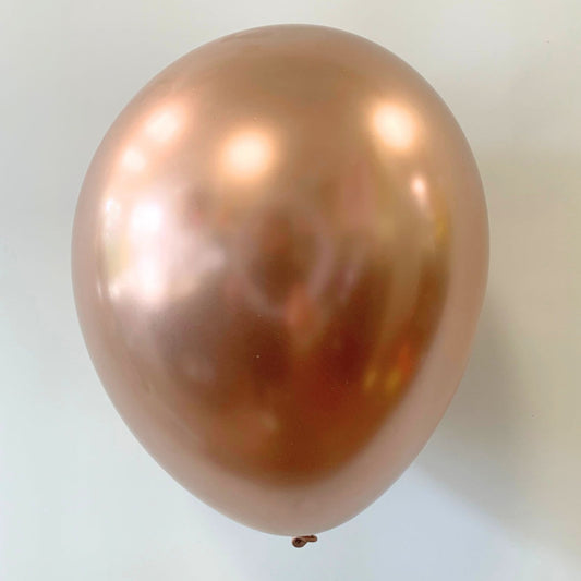 Rose gold balloon on a white background
