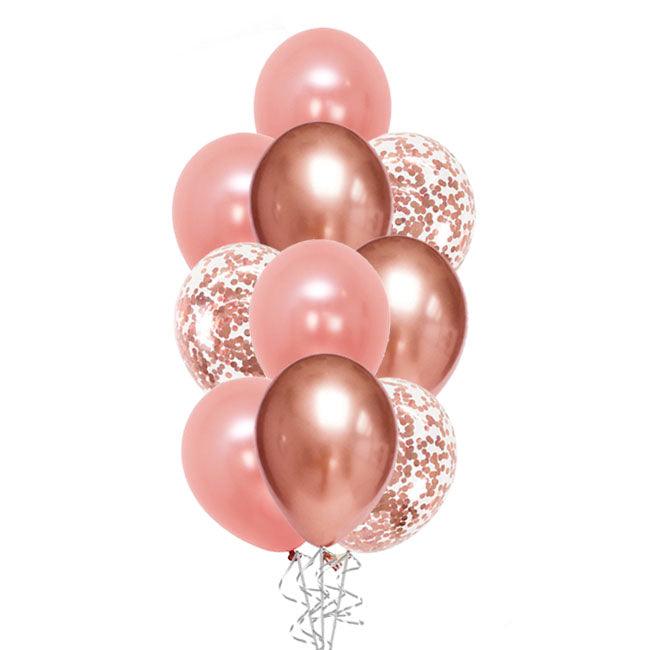 A bouquet of balloons featuring various shades of rose gold, including chrome and matte finishes, with confetti patterns on some.