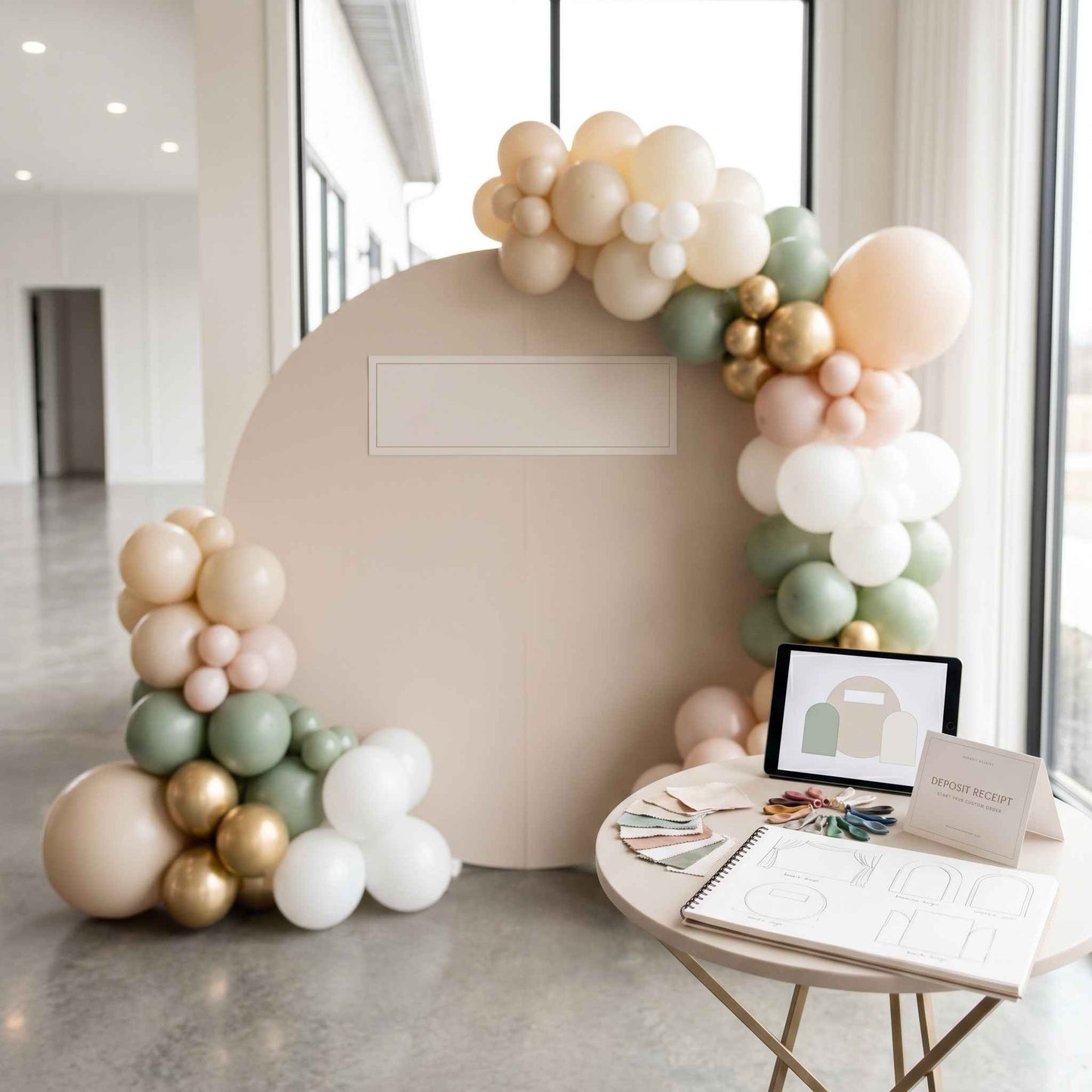 Balloon garland and backdrop with pastel colors in a modern indoor setting