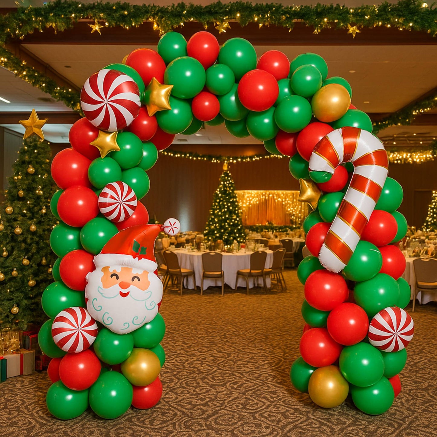 Christmas-themed balloon arch with Santa Claus face in a decorated room.