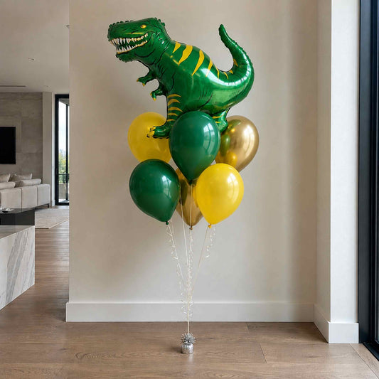 Dinosaur-shaped balloon with green, yellow, and gold balloons in a room.