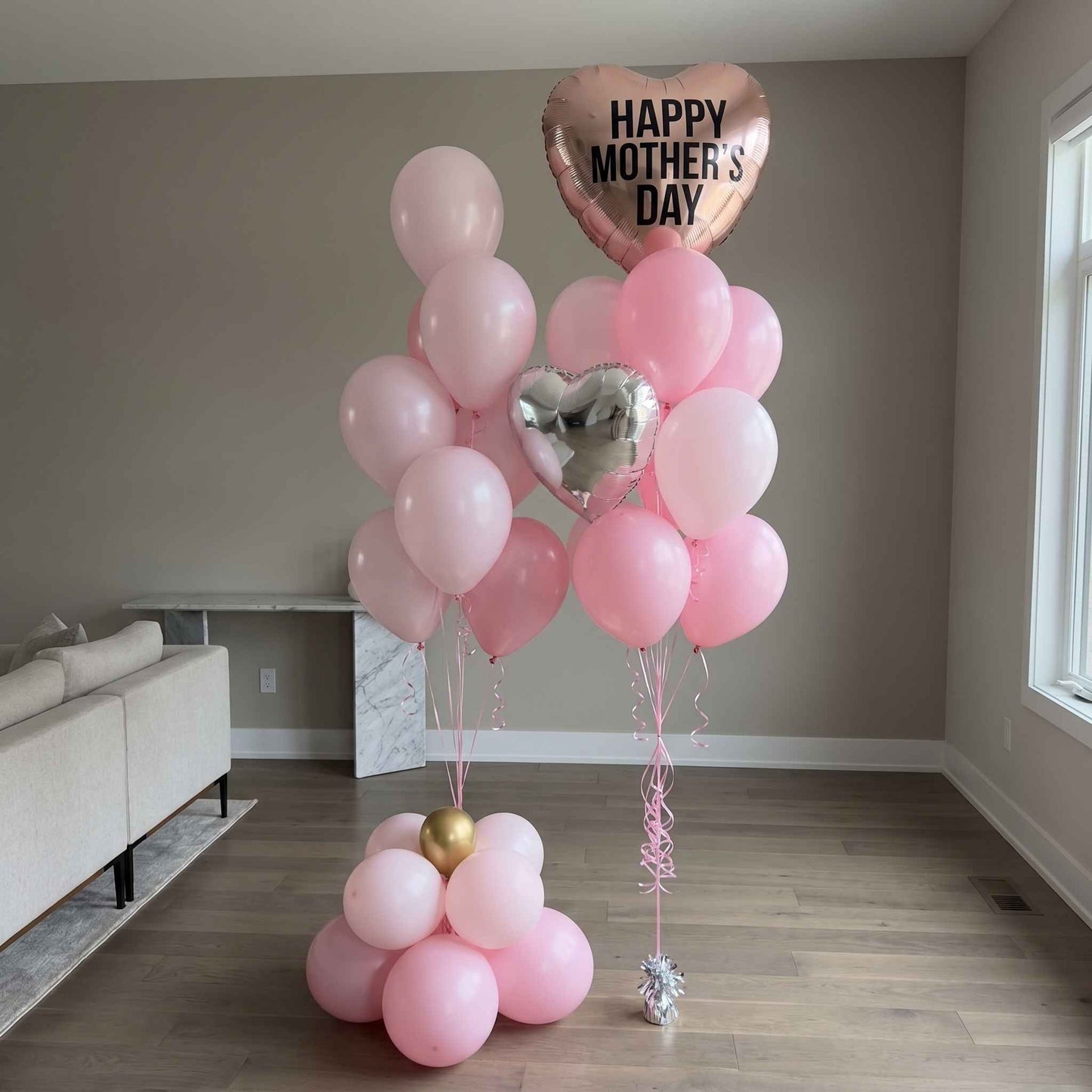 Pink Mother’s Day balloon bouquets with heart foil balloons beige walls