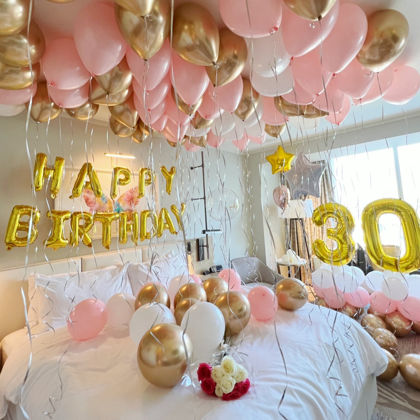 pink white and gold balloons with flowers and foils