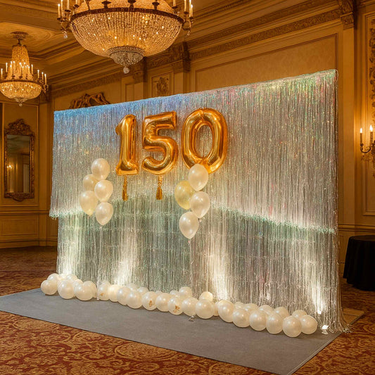 Decorative setup with '150' balloons and streamers in a formal room.