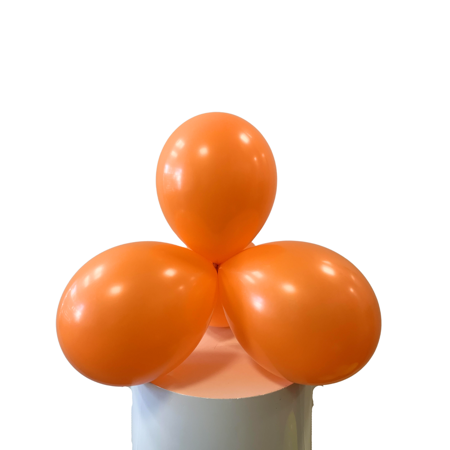 Three orange balloons on a white background
