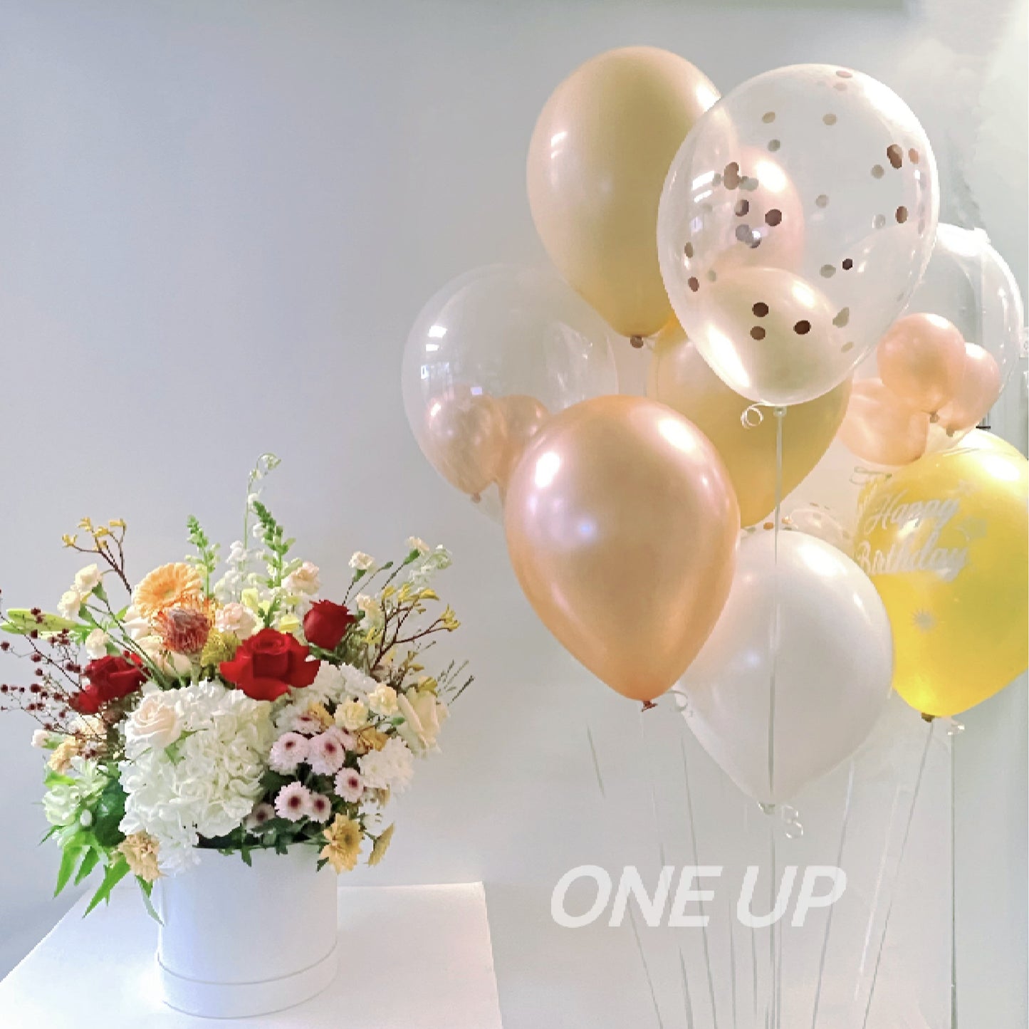 fresh flower box with helium confetti metallic rose gold latex balloon