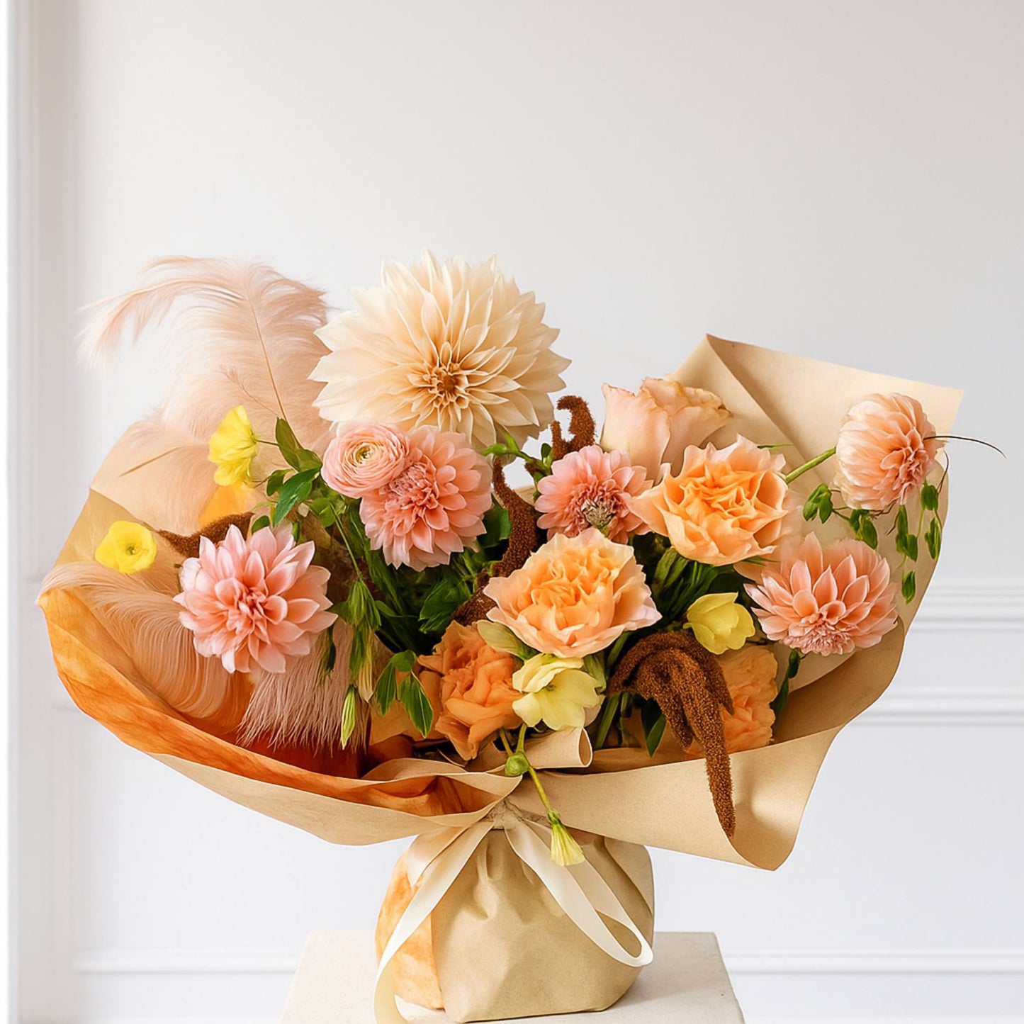 Bouquet of flowers wrapped in brown paper on a white background