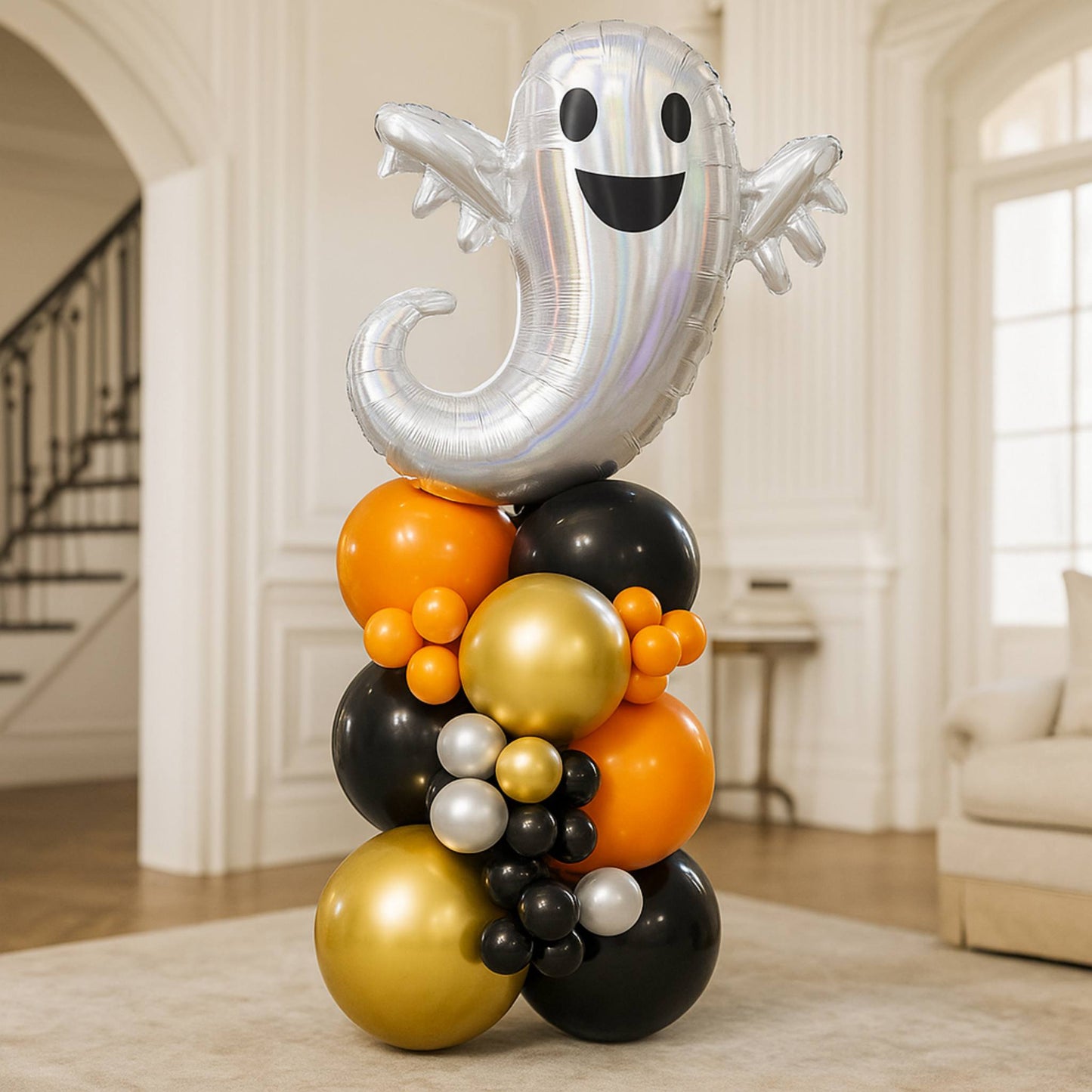 balloon column tower with a silver ghost black, gold, and orange colors