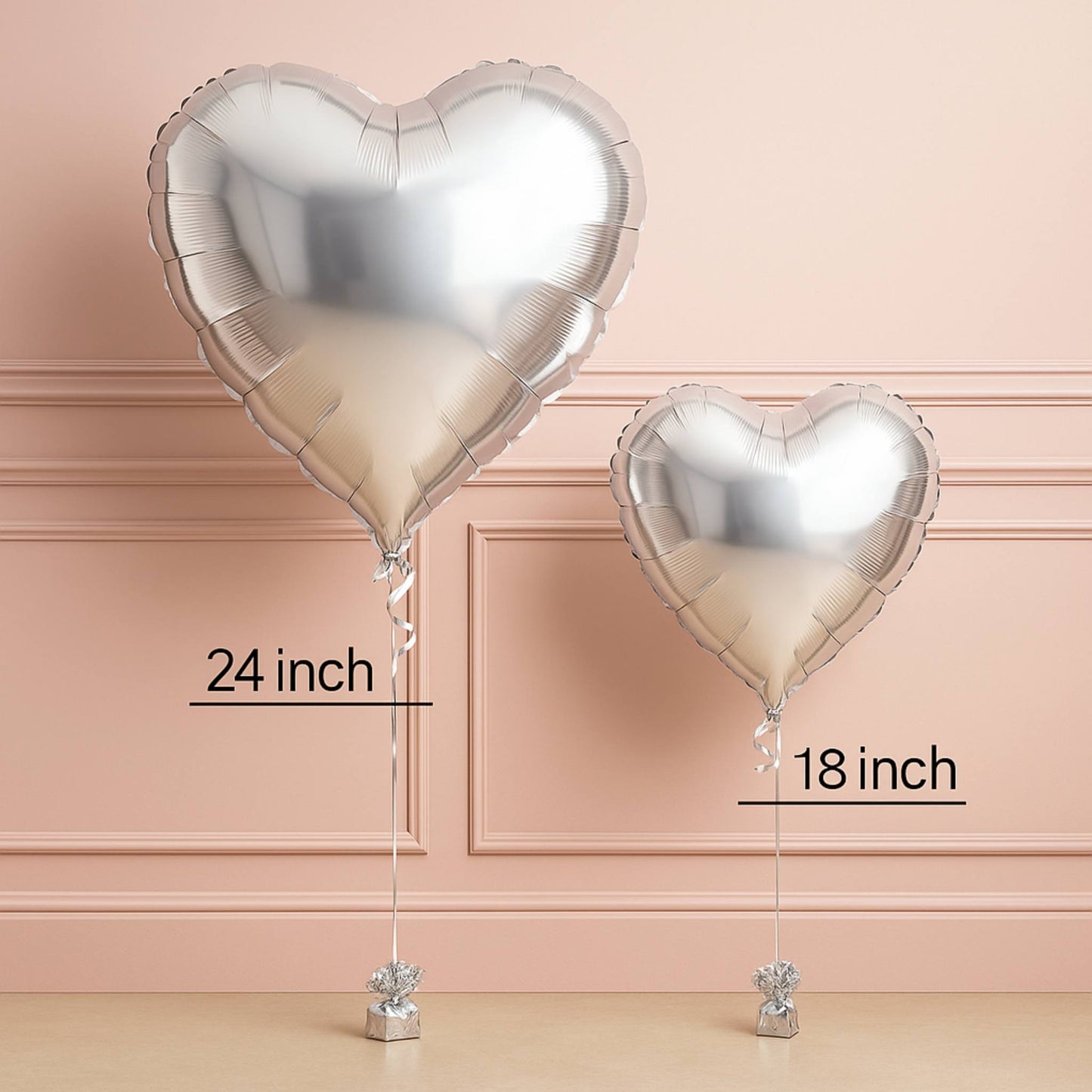 Two heart-shaped balloons with measurements on a beige background
