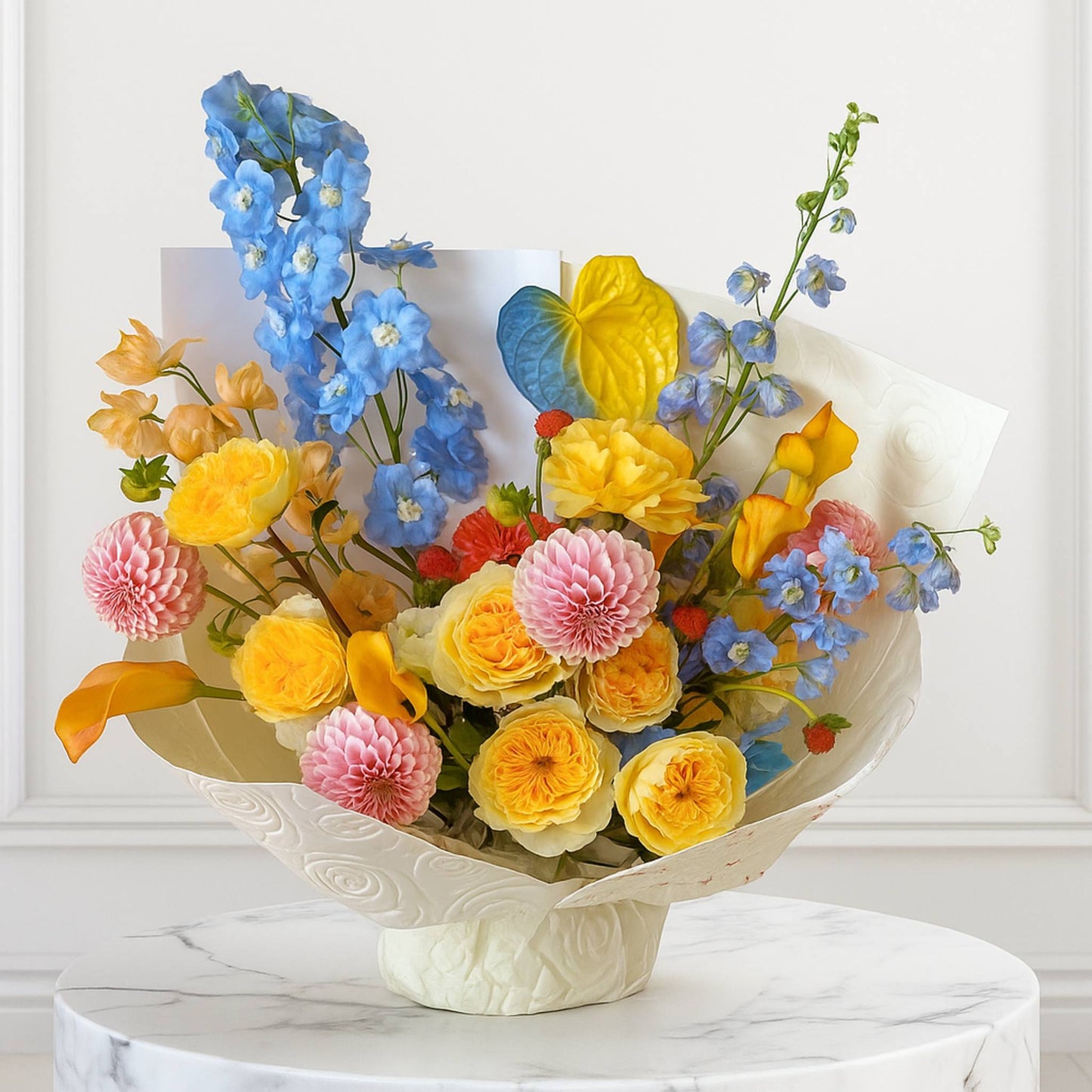Colorful bouquet of flowers in a decorative vase on a marble surface with a white background
