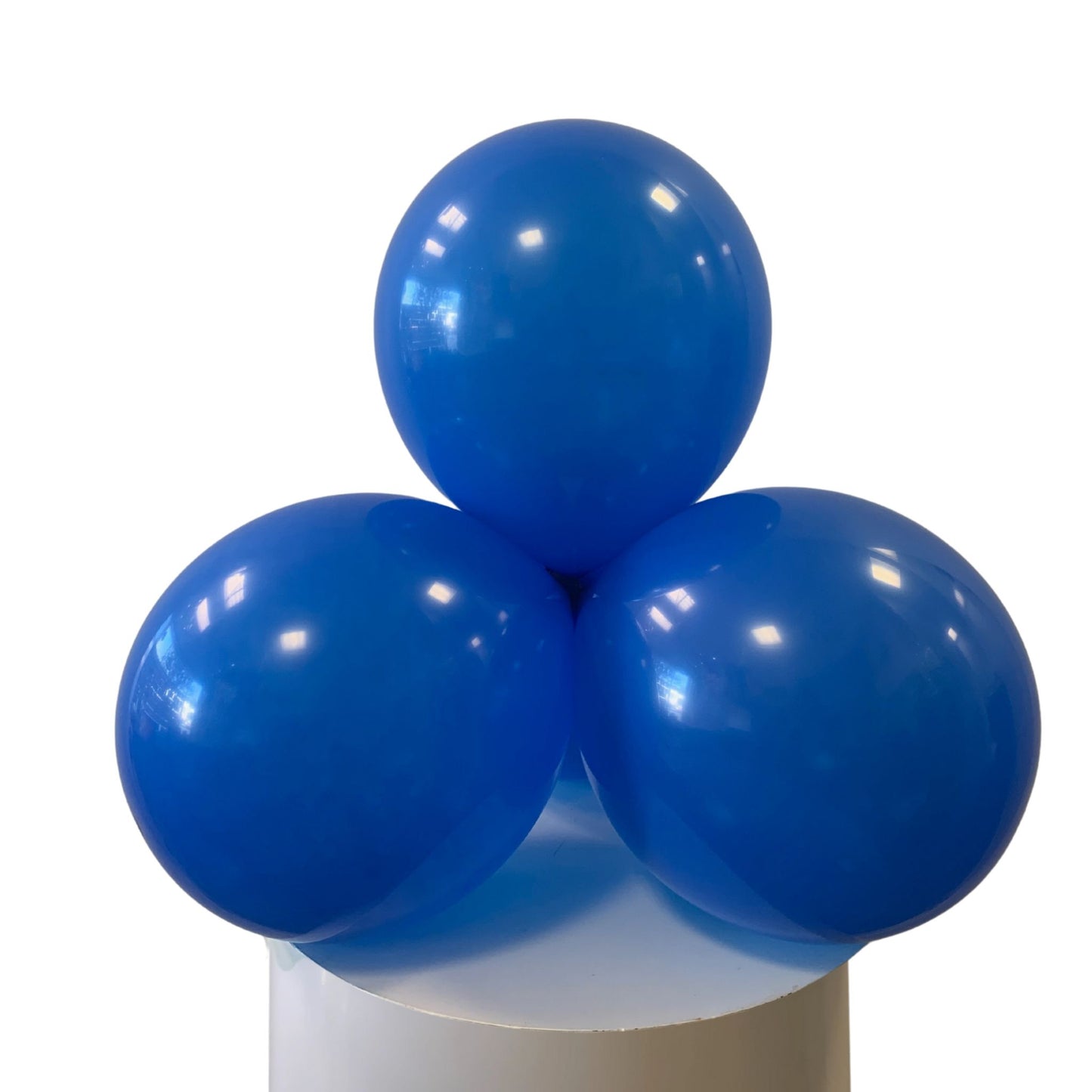 Three blue balloons on a white background