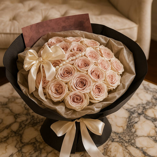 Bouquet of pink roses with a white bow on a marble surface