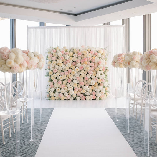 Decorative floral wall with pink and white flowers in a room with chairs and tables.