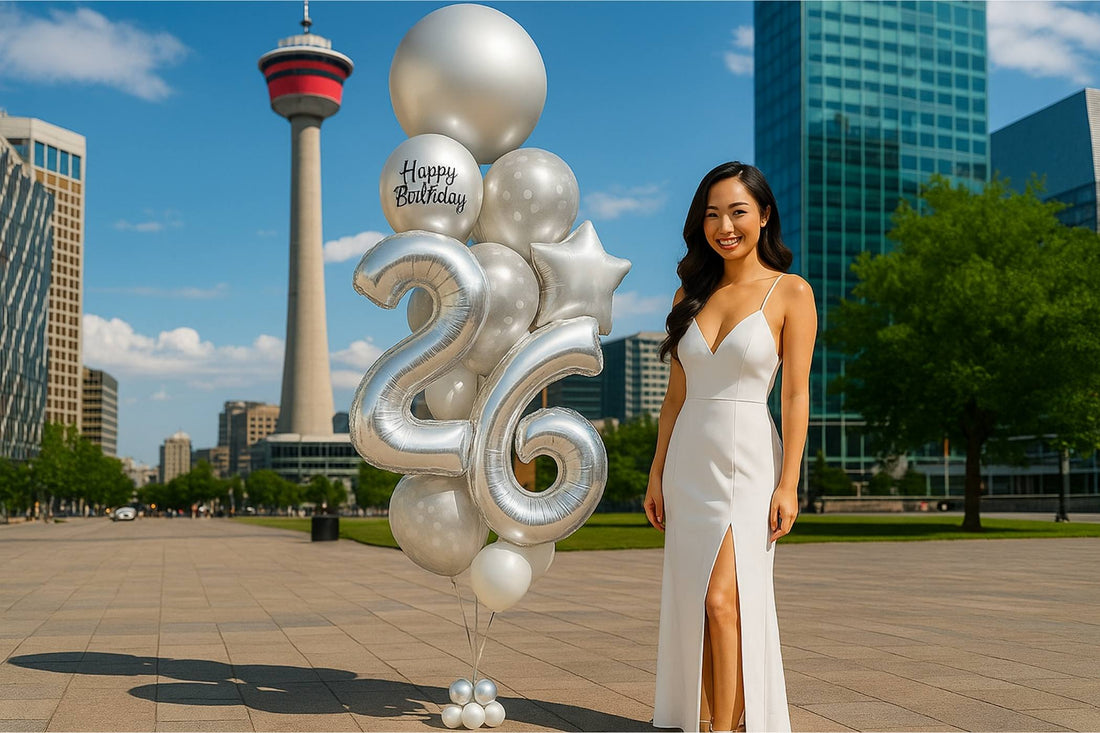 Woman in a white dress standing next to large silver balloons with a cityscape background