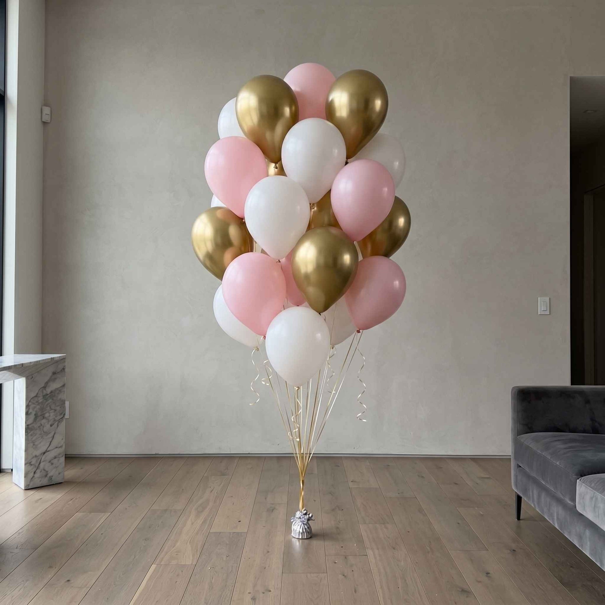 pink white and gold balloons in an apartment large walls