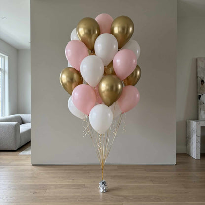 pink, white, and chrome gold balloons in an apartment with large walls natural light