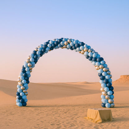 Balloon arch in the desert with a clear sky