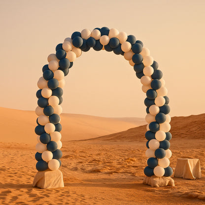 Balloon arch in the desert with a warm color palette