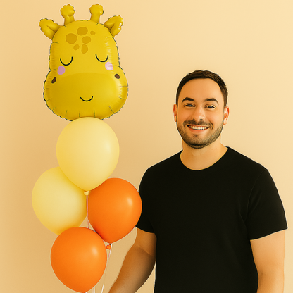 Man holding a giraffe-shaped balloon with orange and yellow balloons against a beige background