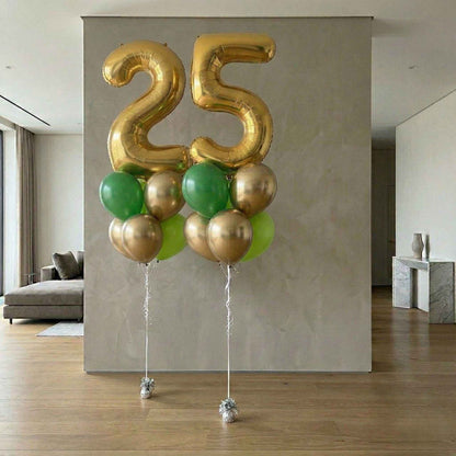 Gold and green balloons shaped like the number 25 in a modern living room.