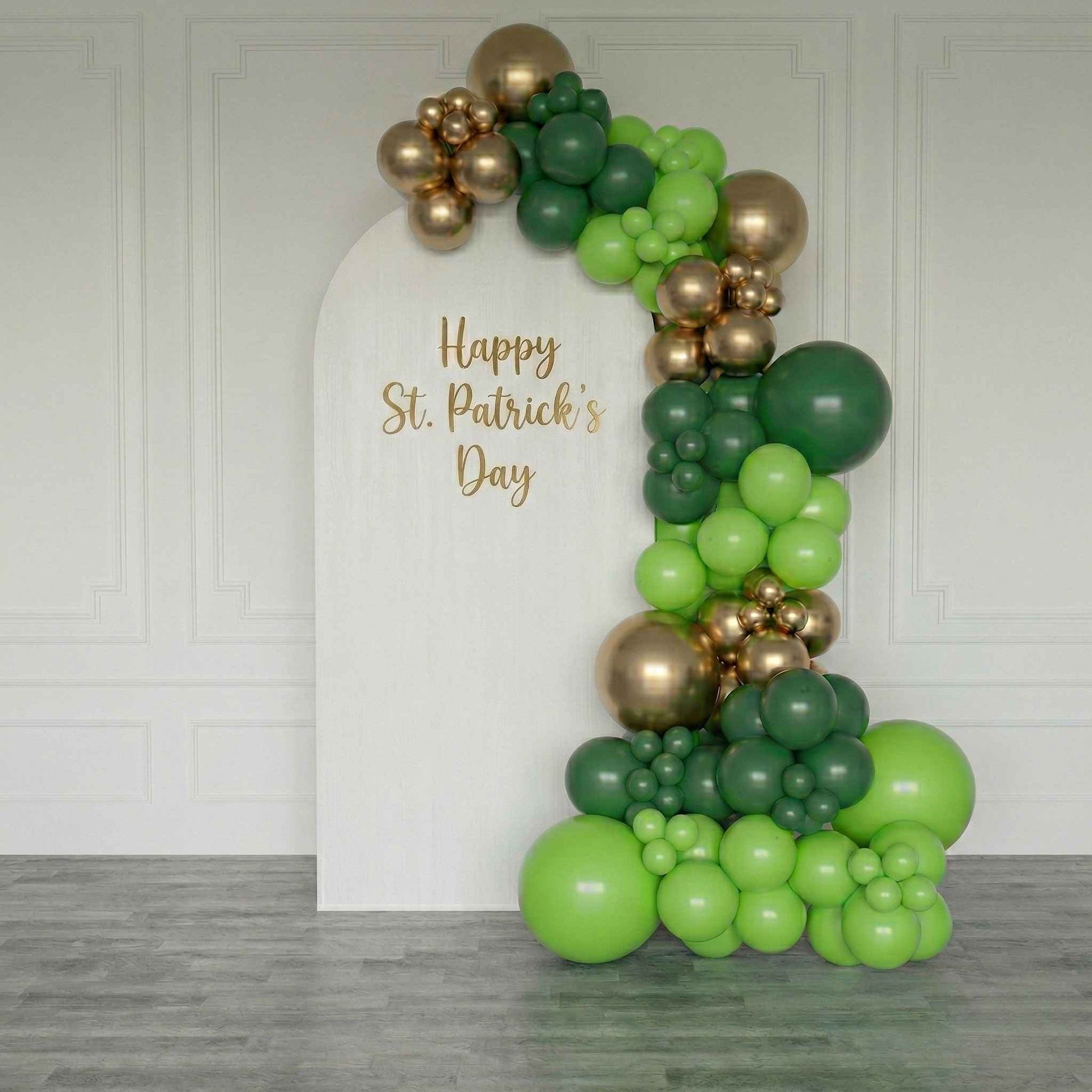 backdrop  St. Patrick's Day balloon arch with 'Happy St. Patrick's Day' text.