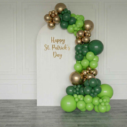 backdrop  St. Patrick's Day balloon arch with 'Happy St. Patrick's Day' text.