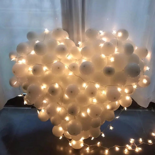 Giant white heart balloon with light strings