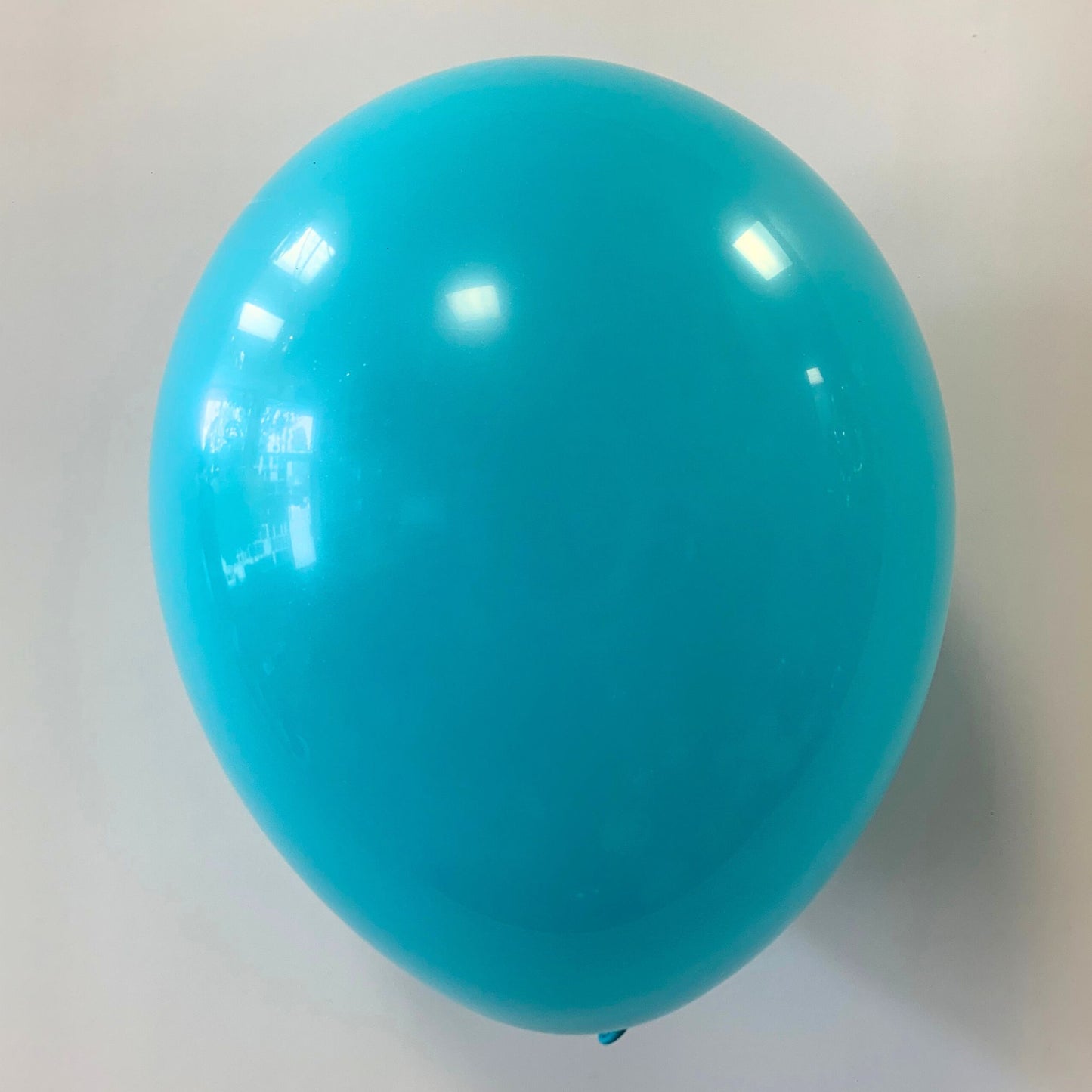 11 inch helium filled Caribbean Blue Latex balloon