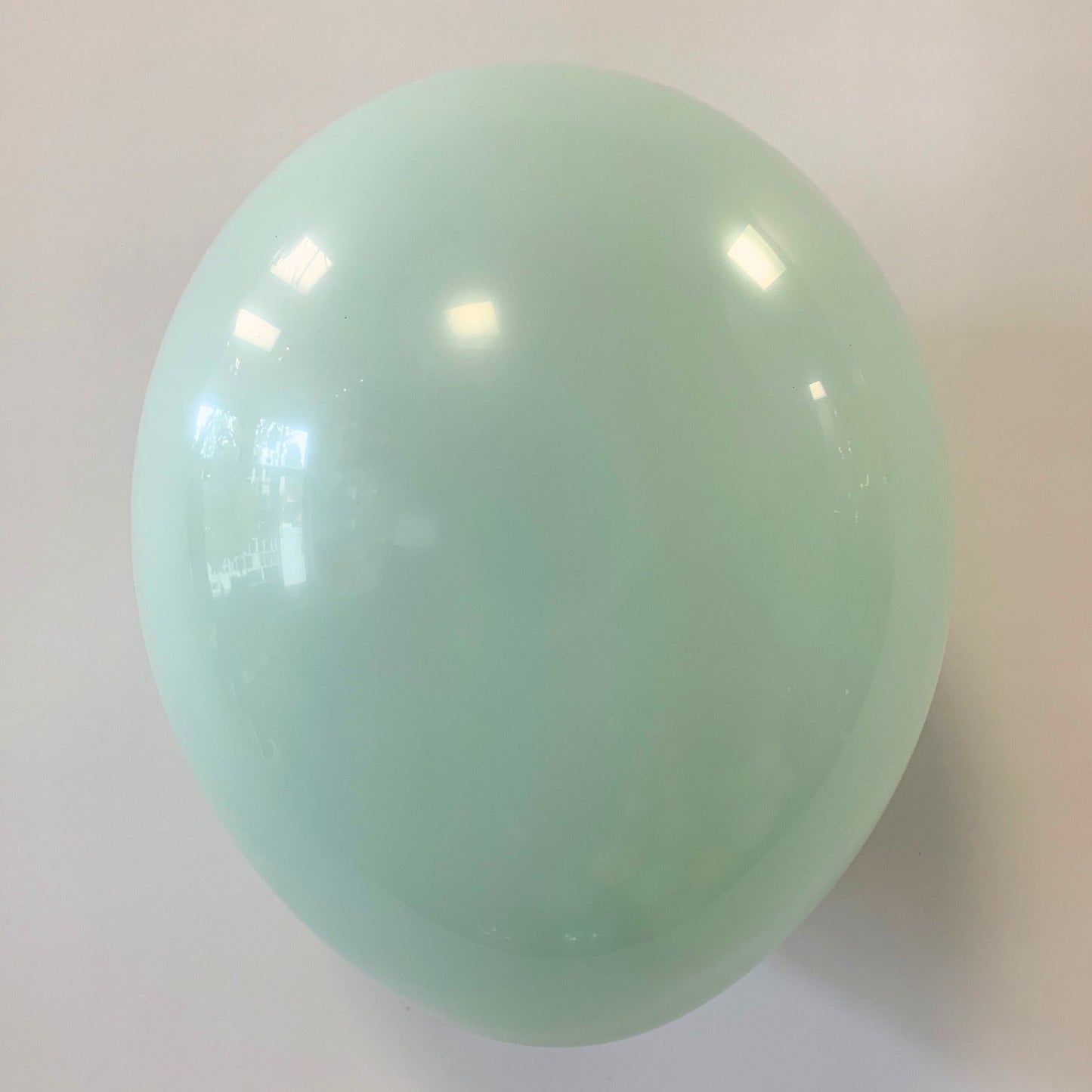 11 inch helium filled Mint latex balloon