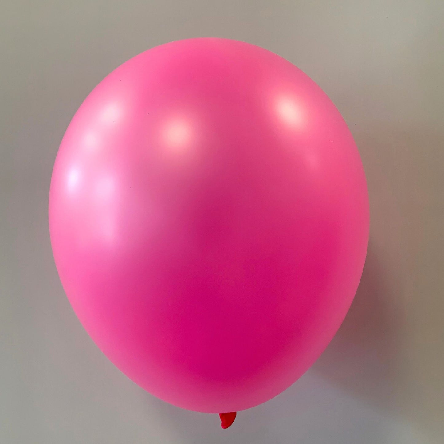 11 inch helium filled Neon Magenta latex balloon