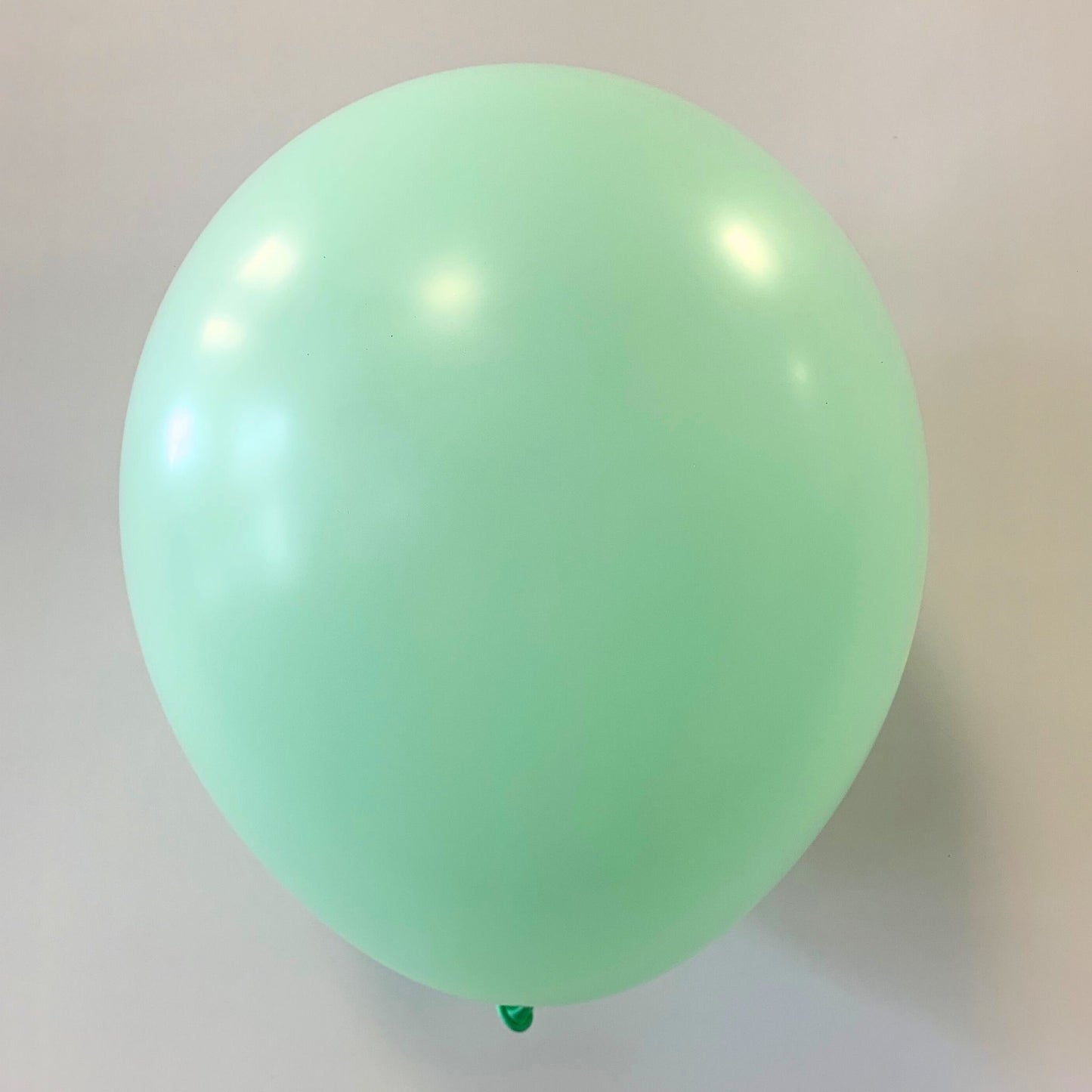 11 inch helium filled Pastel Green latex balloon