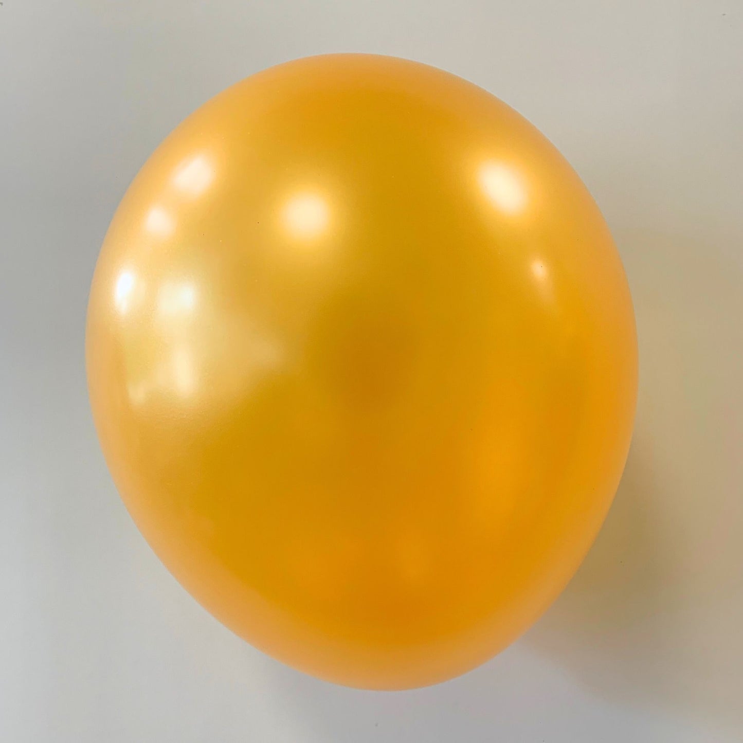 11 inch helium filled Pearl Gold latex balloon
