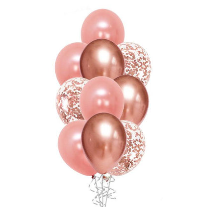A bouquet of balloons featuring various shades of rose gold, including chrome and matte finishes, with confetti patterns on some.