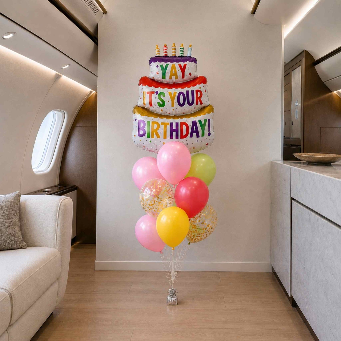 Colorful birthday balloon arrangement in a modern interior setting