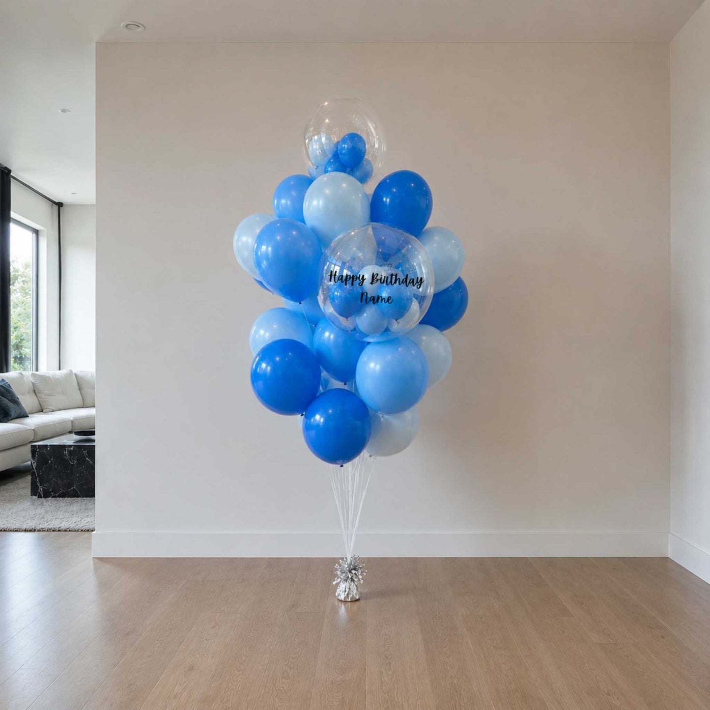 Bouquet of blue and white balloons in a living room setting.