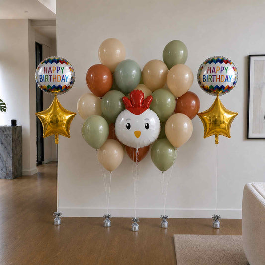 Balloon arrangement with a chicken design and 'Happy Birthday' balloons in a room.