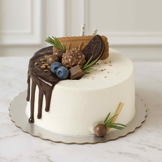 Decorative cake with chocolate, berries, and cookies on a marble surface