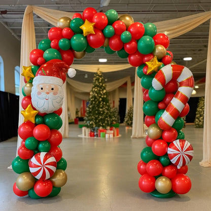 Decorative balloon arch with Santa Claus face and Christmas elements in a festive indoor setting.