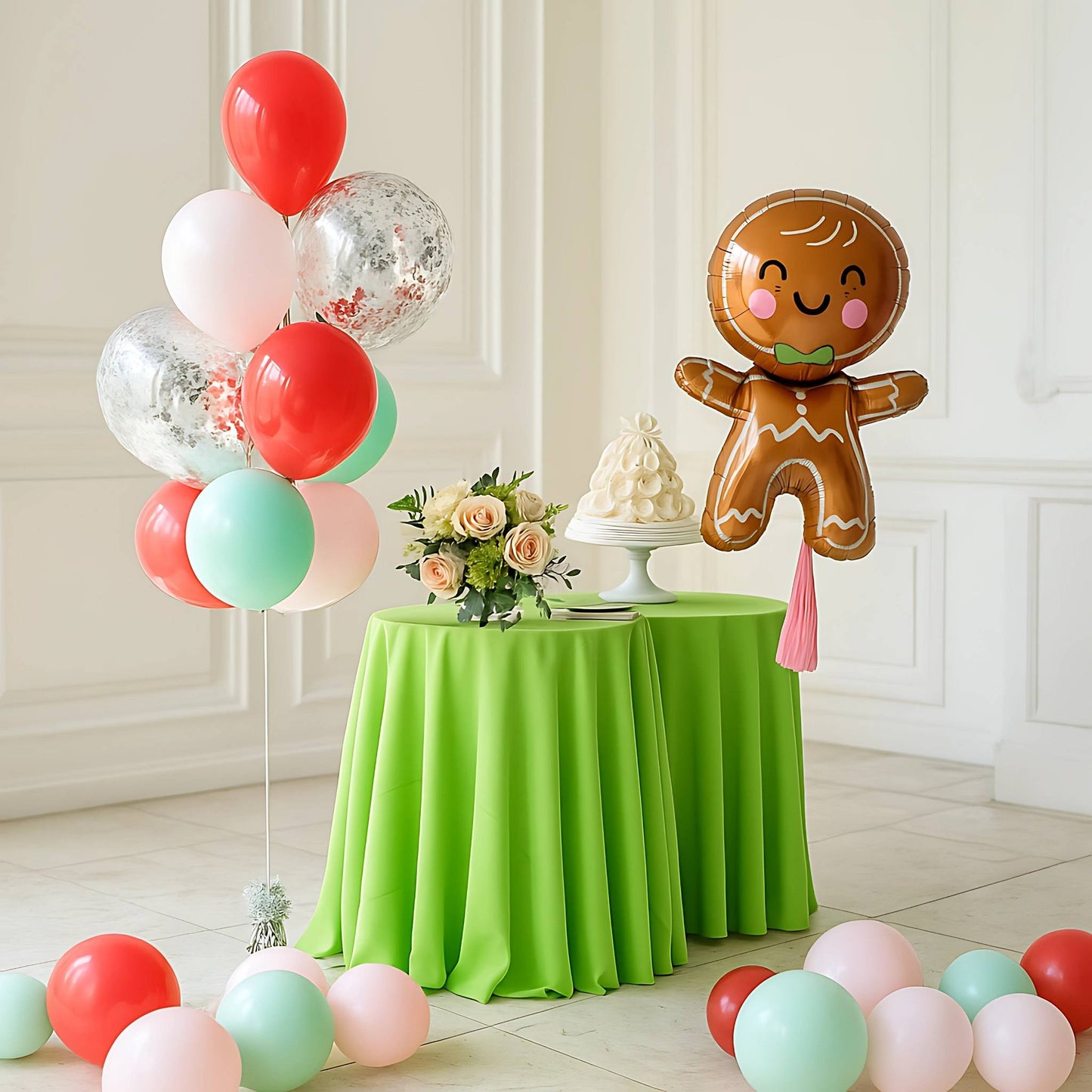 Decorative setup with balloons, a gingerbread man balloon, and a green tablecloth.