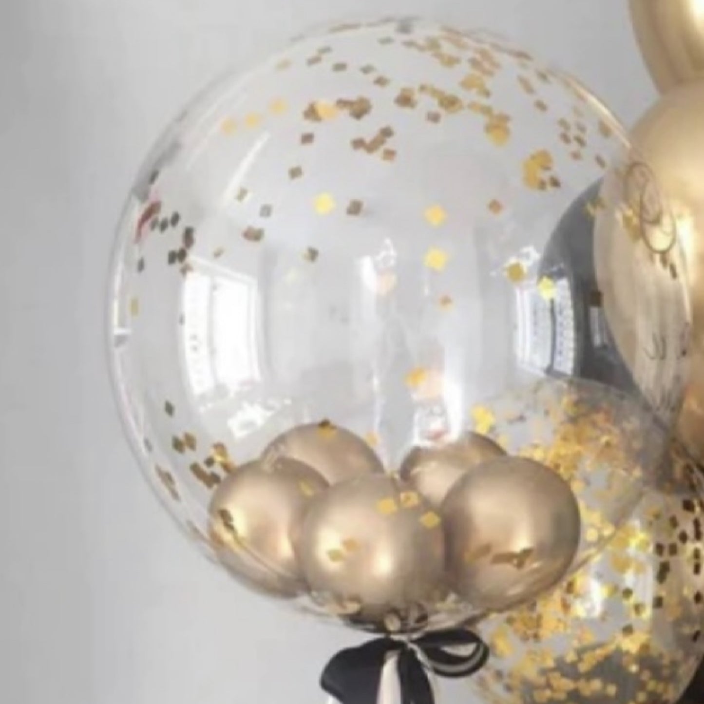 Clear bubble with gold confetti