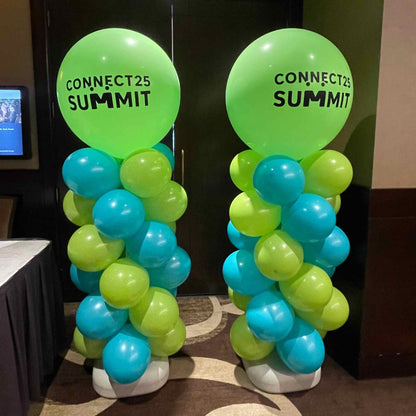 Two balloon arches with 'Connect25 Summit' text in a room setting.