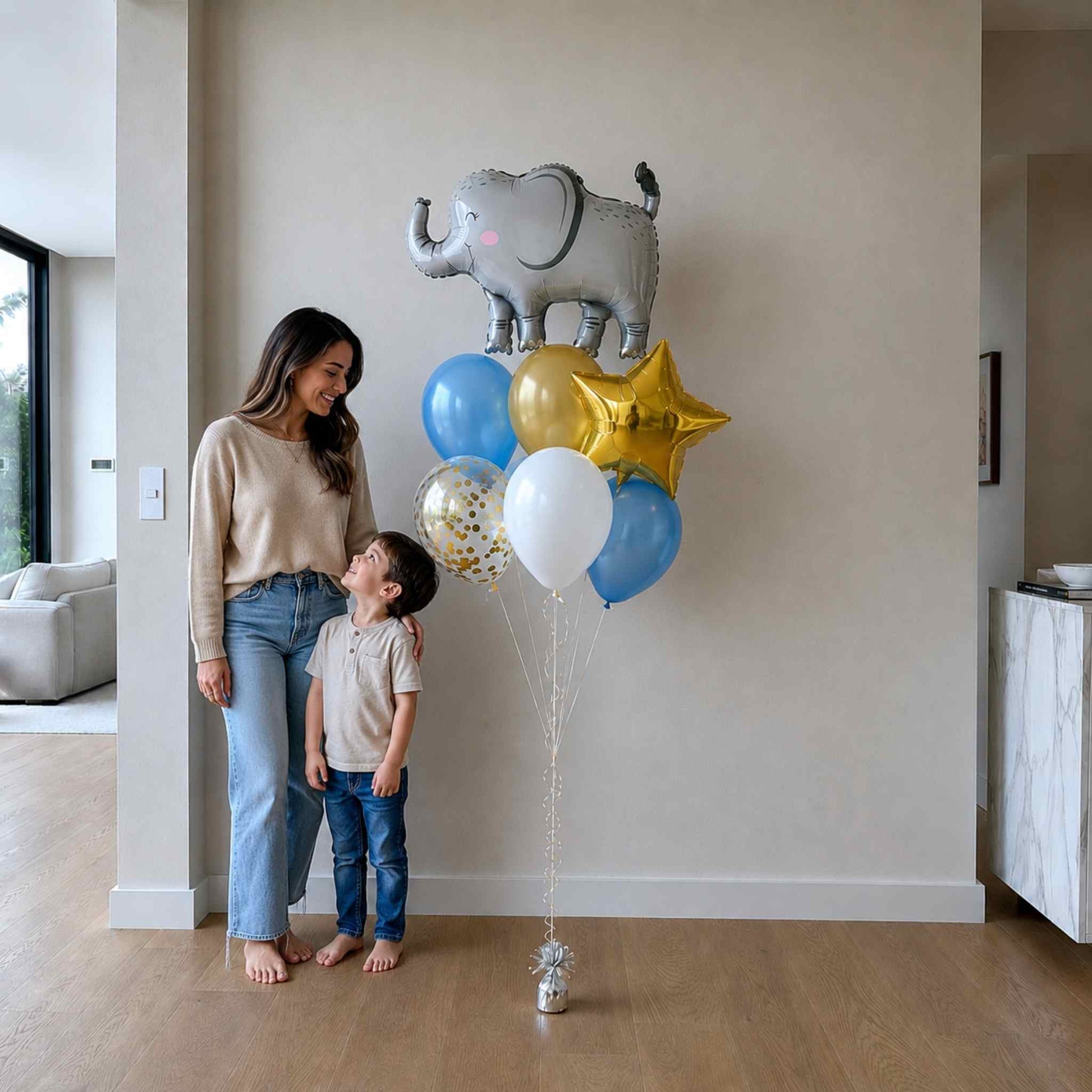 Woman and child standing next to a bouquet of balloons in a living room.