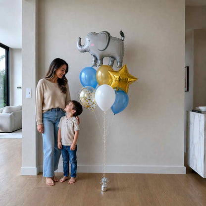 Woman and child standing next to a bouquet of balloons in a living room.