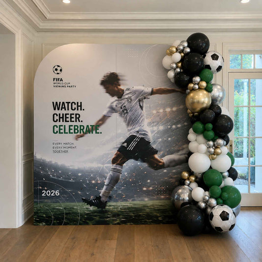 Soccer-themed backdrop with a player and FIFA World Cup 2026 branding, surrounded by soccer balloons.