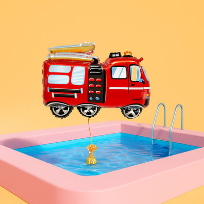 Red fire truck-shaped inflatable toy floating over a pool with a yellow dog toy in the water.