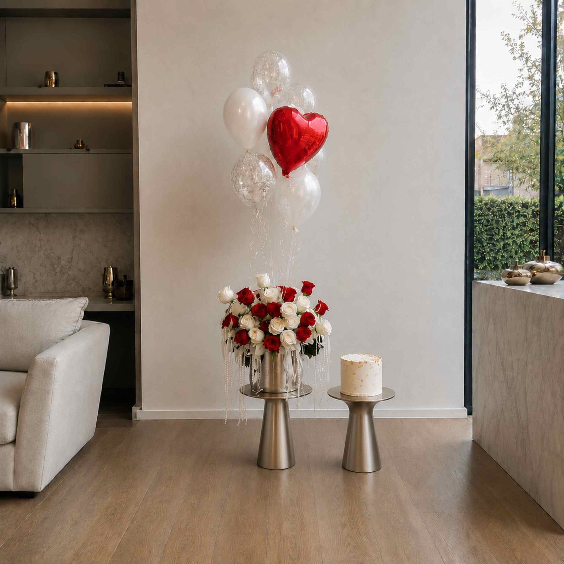 Decorative setup with balloons and flowers in a modern living room.