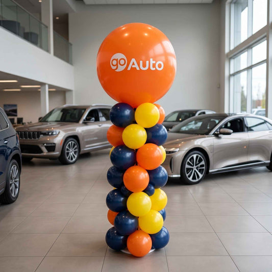 Colorful balloons with 'GO Auto' logo in a car dealership.