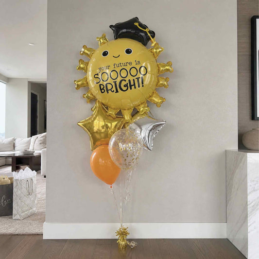 Decorative balloon with 'your future is sooooo bright' text in a living room setting.