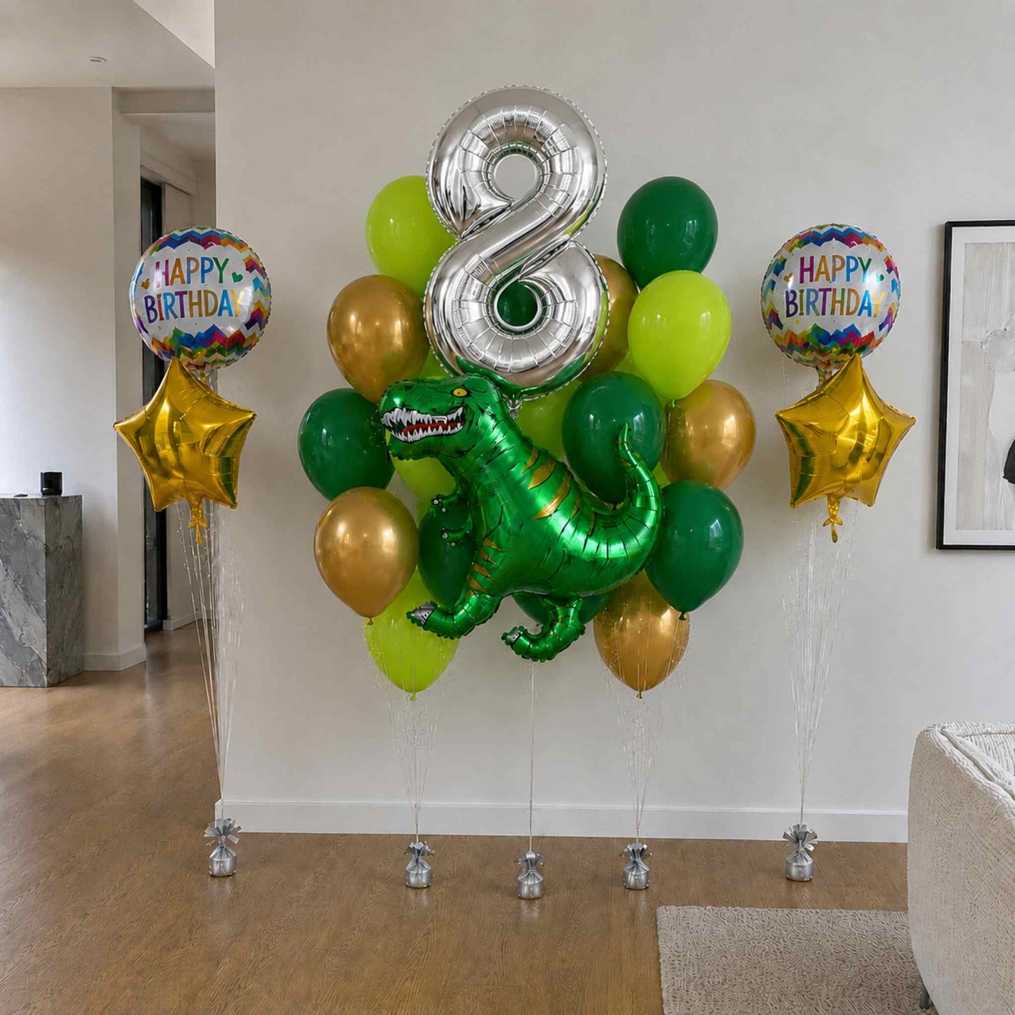 Balloon arrangement with a dinosaur-shaped balloon, number 8 balloon, and 'Happy Birthday' balloons in a living room.
