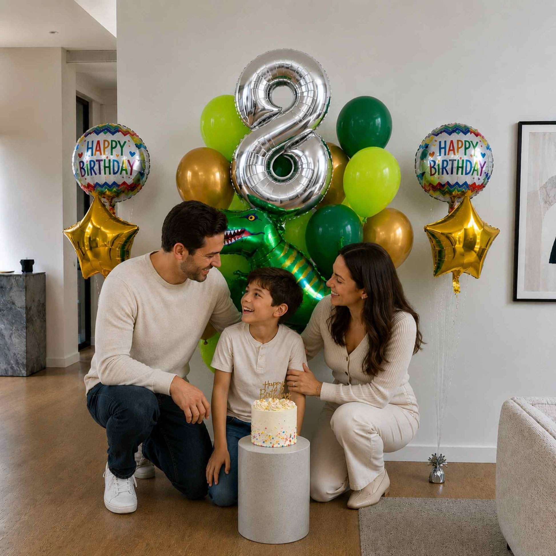 Family celebrating a birthday with balloons and a cake in a living room.